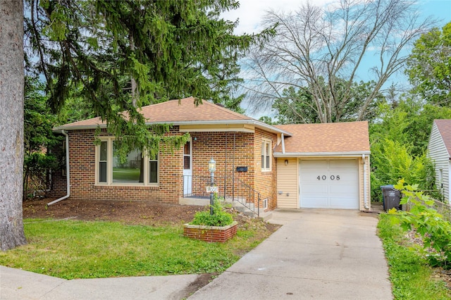 4008 Douglas Ave, Des Moines, IA 50310 - view of front facade with a garage, concrete driveway, a front yard, and brick siding