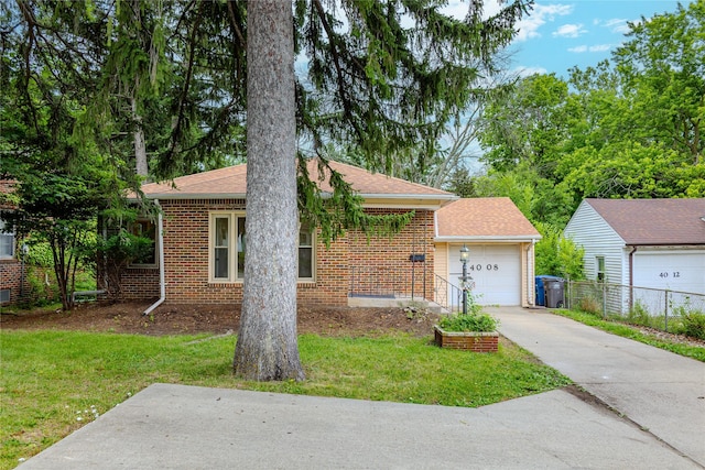 4008 Douglas Ave, Des Moines, IA 50310 - view of front facade with brick siding, an attached garage, concrete driveway, and roof with shingles