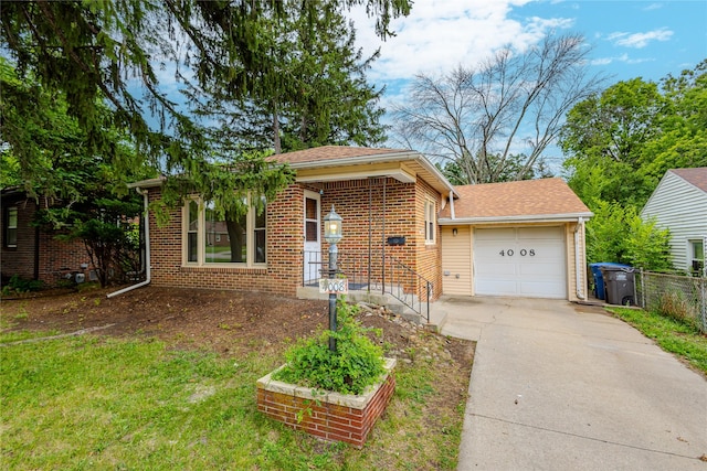 4008 Douglas Ave, Des Moines, IA 50310 - ranch-style house featuring concrete driveway, a garage, and brick siding