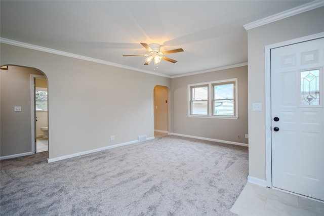 4008 Douglas Ave, Des Moines, IA 50310 - foyer featuring arched walkways, ceiling fan, crown molding, and light colored carpet