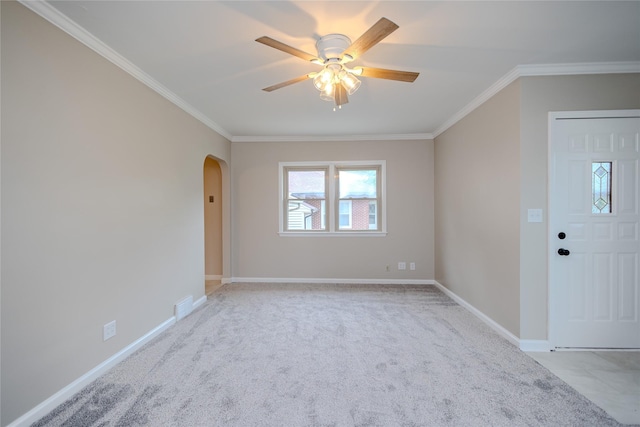 4008 Douglas Ave, Des Moines, IA 50310 - empty room featuring arched walkways, ornamental molding, light colored carpet, and ceiling fan