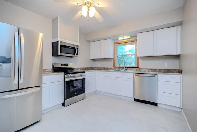 4008 Douglas Ave, Des Moines, IA 50310 - kitchen featuring appliances with stainless steel finishes, a ceiling fan, white cabinetry, and light countertops