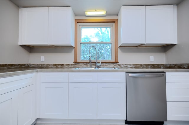 4008 Douglas Ave, Des Moines, IA 50310 - kitchen with stainless steel dishwasher and white cabinetry