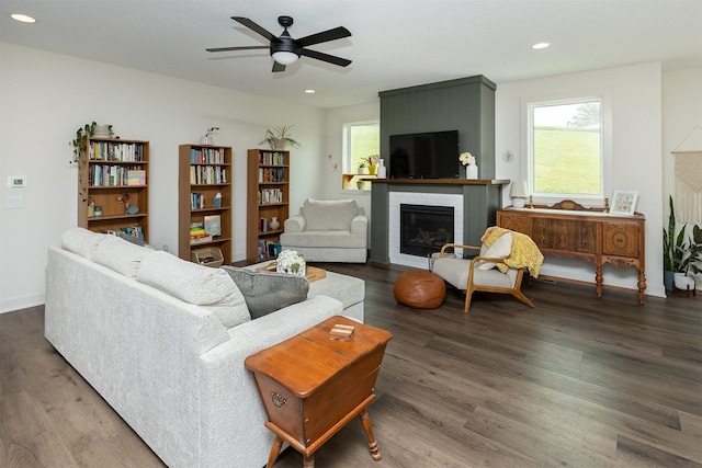 1302 S L Ct, Indianola, IA 50125 - living room with a brick fireplace, wood finished floors, ceiling fan, and recessed lighting