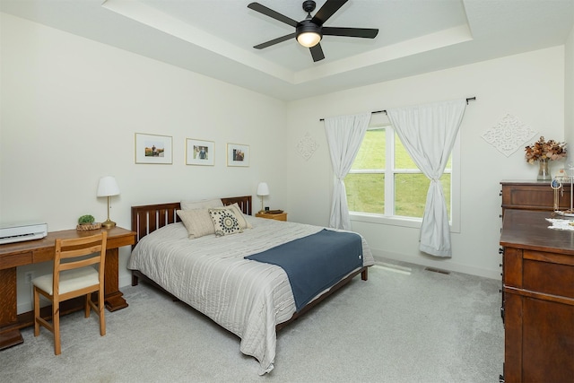1302 S L Ct, Indianola, IA 50125 - bedroom featuring carpet flooring, a raised ceiling, and a ceiling fan
