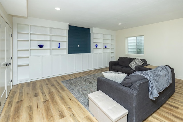 1302 S L Ct, Indianola, IA 50125 - living room featuring wood finished floors, built in features, and recessed lighting