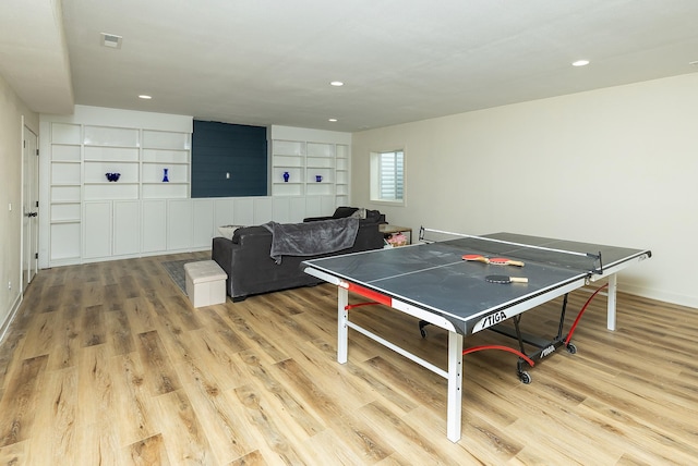 1302 S L Ct, Indianola, IA 50125 - rec room with wood finished floors, recessed lighting, and built in shelves