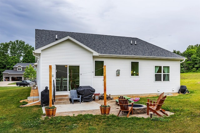 1302 S L Ct, Indianola, IA 50125 - rear view of property with a lawn, an outdoor fire pit, entry steps, a patio, and roof with shingles