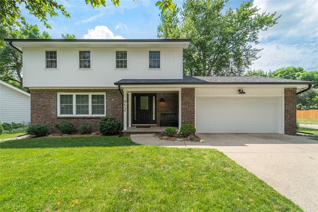 912 23rd St, West Des Moines, IA 50265 - view of front facade featuring brick siding, an attached garage, concrete driveway, and a front lawn
