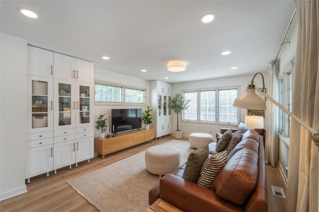 912 23rd St, West Des Moines, IA 50265 - living area featuring light wood-style floors and recessed lighting