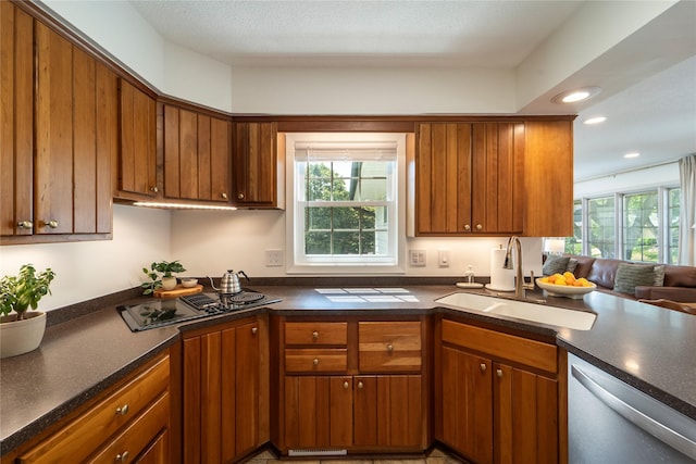 912 23rd St, West Des Moines, IA 50265 - kitchen featuring dishwashing machine, black electric stovetop, dark countertops, brown cabinetry, and recessed lighting