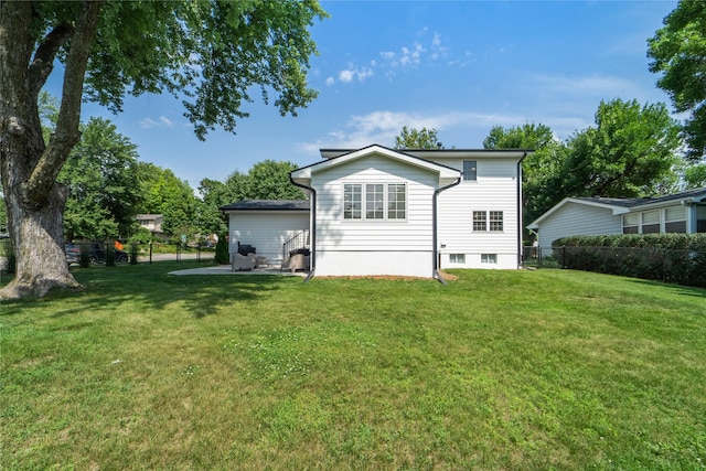 912 23rd St, West Des Moines, IA 50265 - rear view of property featuring a patio