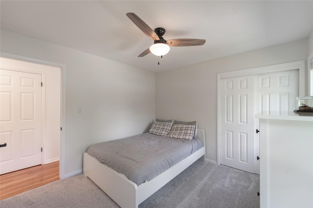 912 23rd St, West Des Moines, IA 50265 - carpeted bedroom with a closet and ceiling fan