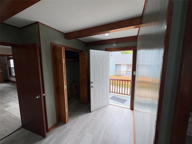 3206 62nd St, Des Moines, IA 50322 - hall with healthy amount of natural light, light wood-type flooring, and beam ceiling