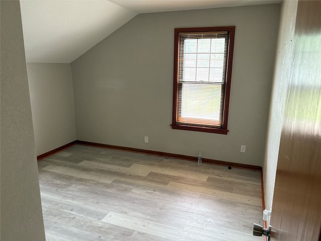 3206 62nd St, Des Moines, IA 50322 - additional living space featuring vaulted ceiling and light wood-style floors