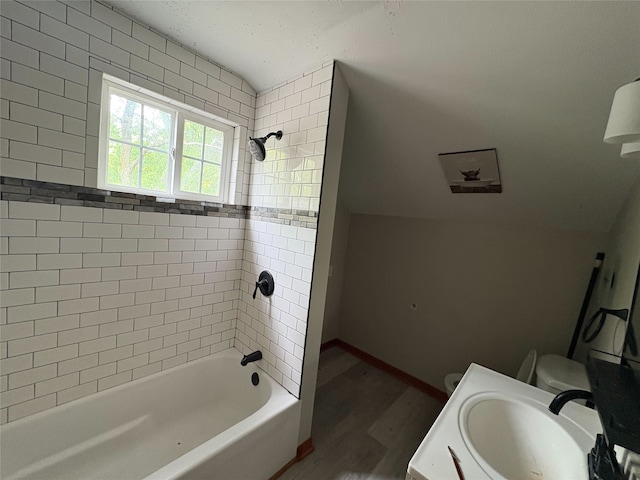 3206 62nd St, Des Moines, IA 50322 - full bath featuring wood finished floors, shower / tub combination, and vanity