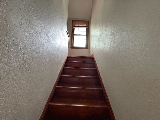 3206 62nd St, Des Moines, IA 50322 - staircase featuring a textured wall