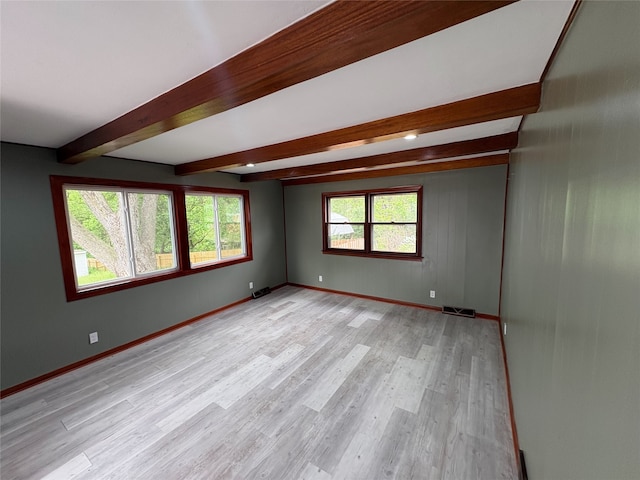 3206 62nd St, Des Moines, IA 50322 - unfurnished room with beam ceiling and light wood finished floors