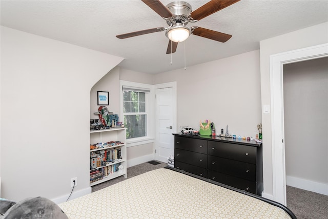 5617 Grand Ave, Des Moines, IA 50312 - carpeted bedroom featuring baseboards and a ceiling fan