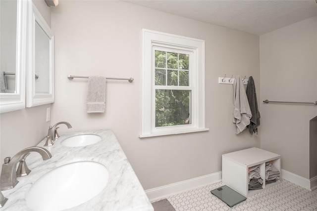 5617 Grand Ave, Des Moines, IA 50312 - full bathroom with double vanity and baseboards