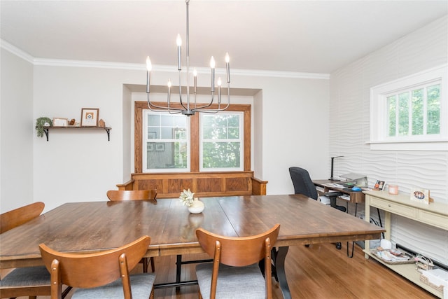 5617 Grand Ave, Des Moines, IA 50312 - dining space with a chandelier, wood finished floors, crown molding, and a desk