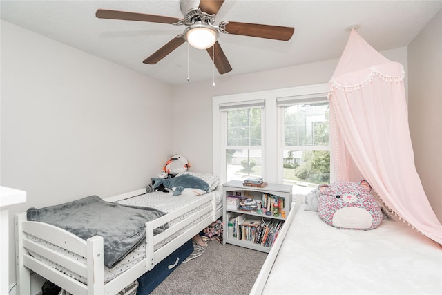 5617 Grand Ave, Des Moines, IA 50312 - bedroom featuring carpet and a ceiling fan