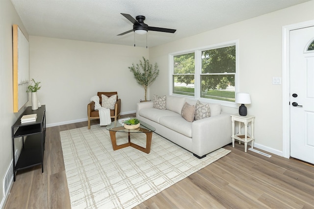 401 NE Harvey St, Grimes, IA 50111 - living room featuring wood finished floors and a ceiling fan
