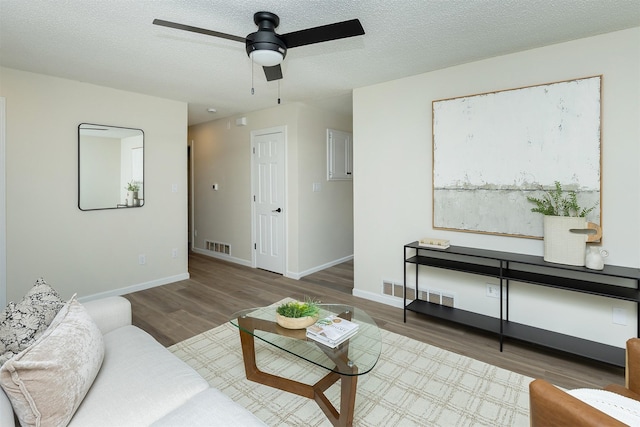 401 NE Harvey St, Grimes, IA 50111 - living area featuring wood finished floors and a ceiling fan
