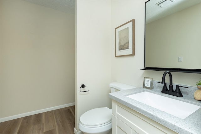 401 NE Harvey St, Grimes, IA 50111 - bathroom with wood finished floors and vanity