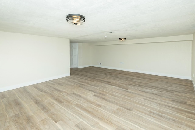 401 NE Harvey St, Grimes, IA 50111 - unfurnished room with baseboards and light wood finished floors