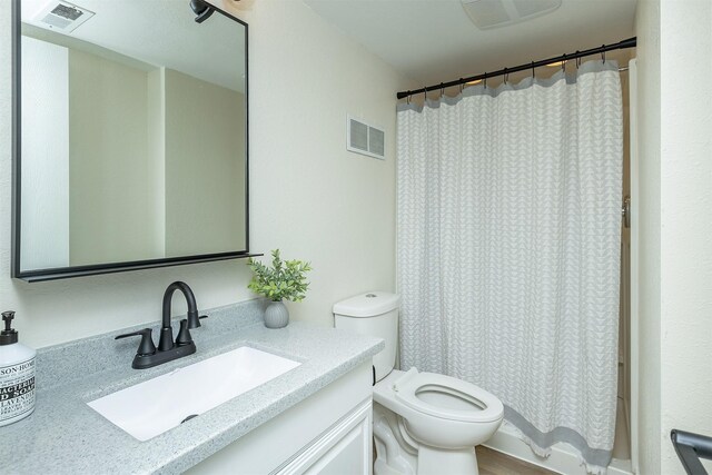 401 NE Harvey St, Grimes, IA 50111 - bathroom featuring vanity and toilet