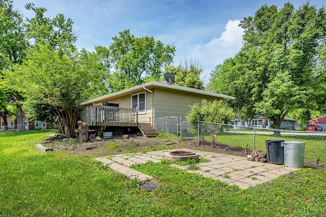 401 NE Harvey St, Grimes, IA 50111 - view of side of home featuring an outdoor fire pit, a deck, and a patio