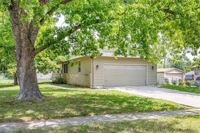 401 NE Harvey St, Grimes, IA 50111 - view of front of property with driveway and an attached garage