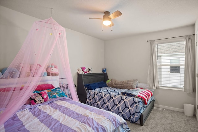 4410 NE Mongoose Ln, Ankeny, IA 50021 - carpeted bedroom with ceiling fan and baseboards