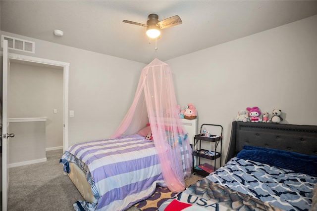 4410 NE Mongoose Ln, Ankeny, IA 50021 - carpeted bedroom featuring ceiling fan and baseboards