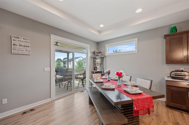 5397 Brook View Ave, Des Moines, IA 50317 - dining area featuring light wood-type flooring, recessed lighting, and a raised ceiling