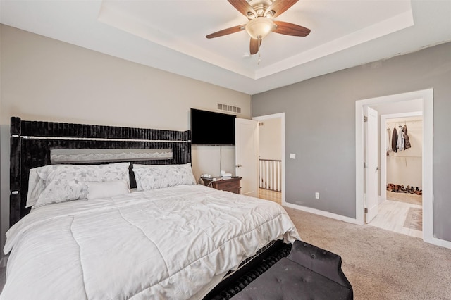 5397 Brook View Ave, Des Moines, IA 50317 - bedroom with a raised ceiling, carpet, and a ceiling fan