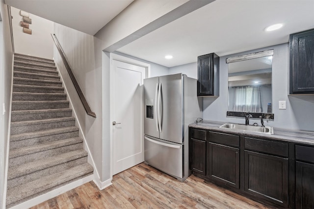 5397 Brook View Ave, Des Moines, IA 50317 - kitchen featuring stainless steel refrigerator with ice dispenser, light wood-type flooring, light countertops, and recessed lighting