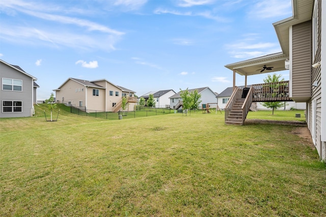 5397 Brook View Ave, Des Moines, IA 50317 - view of yard with a ceiling fan, a residential view, and stairs
