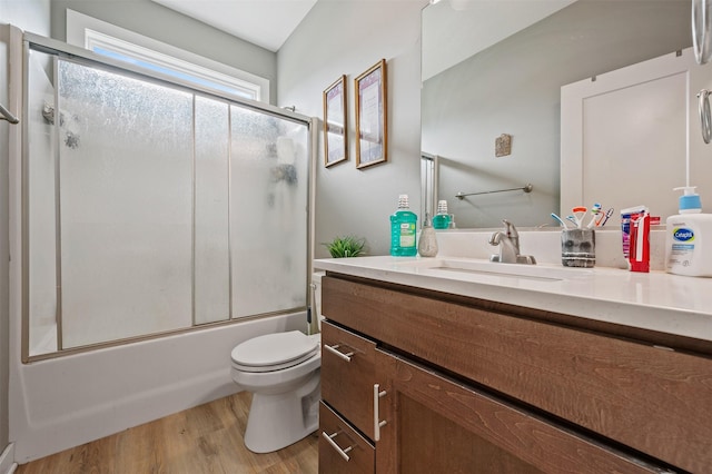 5397 Brook View Ave, Des Moines, IA 50317 - full bathroom featuring vanity, wood finished floors, and combined bath / shower with glass door