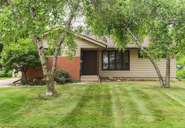 2217 Meadow Ln, West Des Moines, IA 50265 - view of front of property featuring a front yard and entry steps