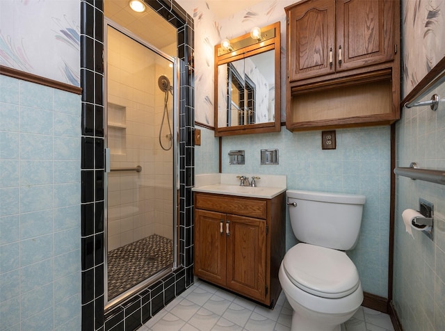 2217 Meadow Ln, West Des Moines, IA 50265 - full bathroom with vanity, a shower stall, tile patterned floors, and tile walls