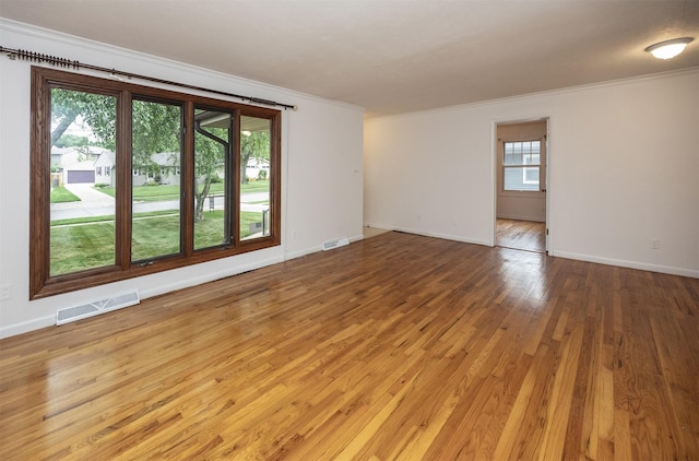 2217 Meadow Ln, West Des Moines, IA 50265 - empty room featuring crown molding and light wood-style floors
