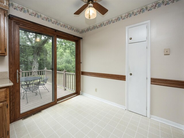 2217 Meadow Ln, West Des Moines, IA 50265 - spare room featuring baseboards and ceiling fan
