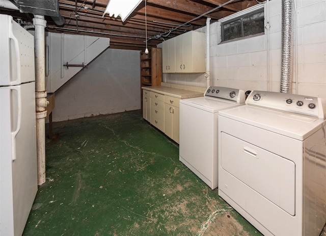 2217 Meadow Ln, West Des Moines, IA 50265 - washroom featuring separate washer and dryer and cabinet space
