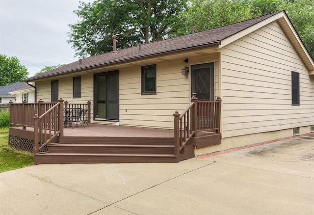 2217 Meadow Ln, West Des Moines, IA 50265 - view of front of property featuring roof with shingles and a wooden deck