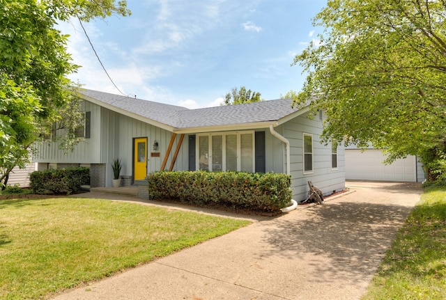 8786 Primrose Ln, Clive, IA 50325 - view of front of property featuring roof with shingles, a front lawn, board and batten siding, and concrete driveway