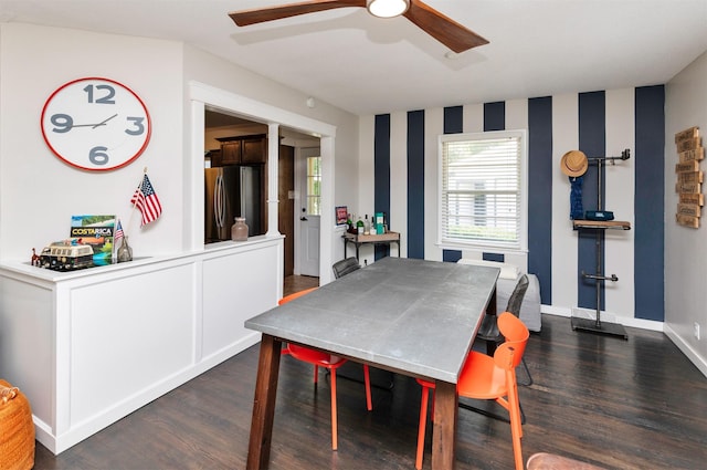 8786 Primrose Ln, Clive, IA 50325 - dining space with ceiling fan, wallpapered walls, and dark wood-style flooring