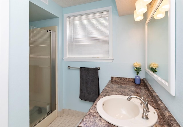 8786 Primrose Ln, Clive, IA 50325 - full bath featuring a stall shower, vanity, and tile patterned flooring