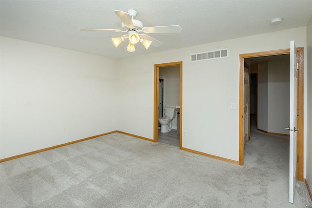 2240 Hart Ave Unit 4, Des Moines, IA 50320 - unfurnished bedroom with light carpet, a ceiling fan, and ensuite bathroom